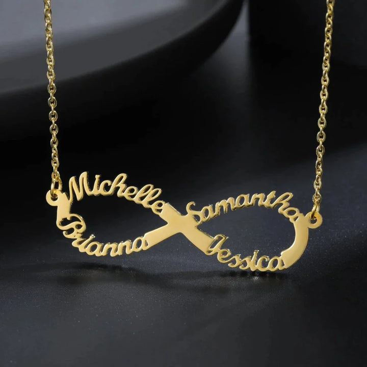 Gold Personalized Infinity Name Necklace with custom names Michelle, Samantha, Brianna, and Jessica, displayed on a dark background.