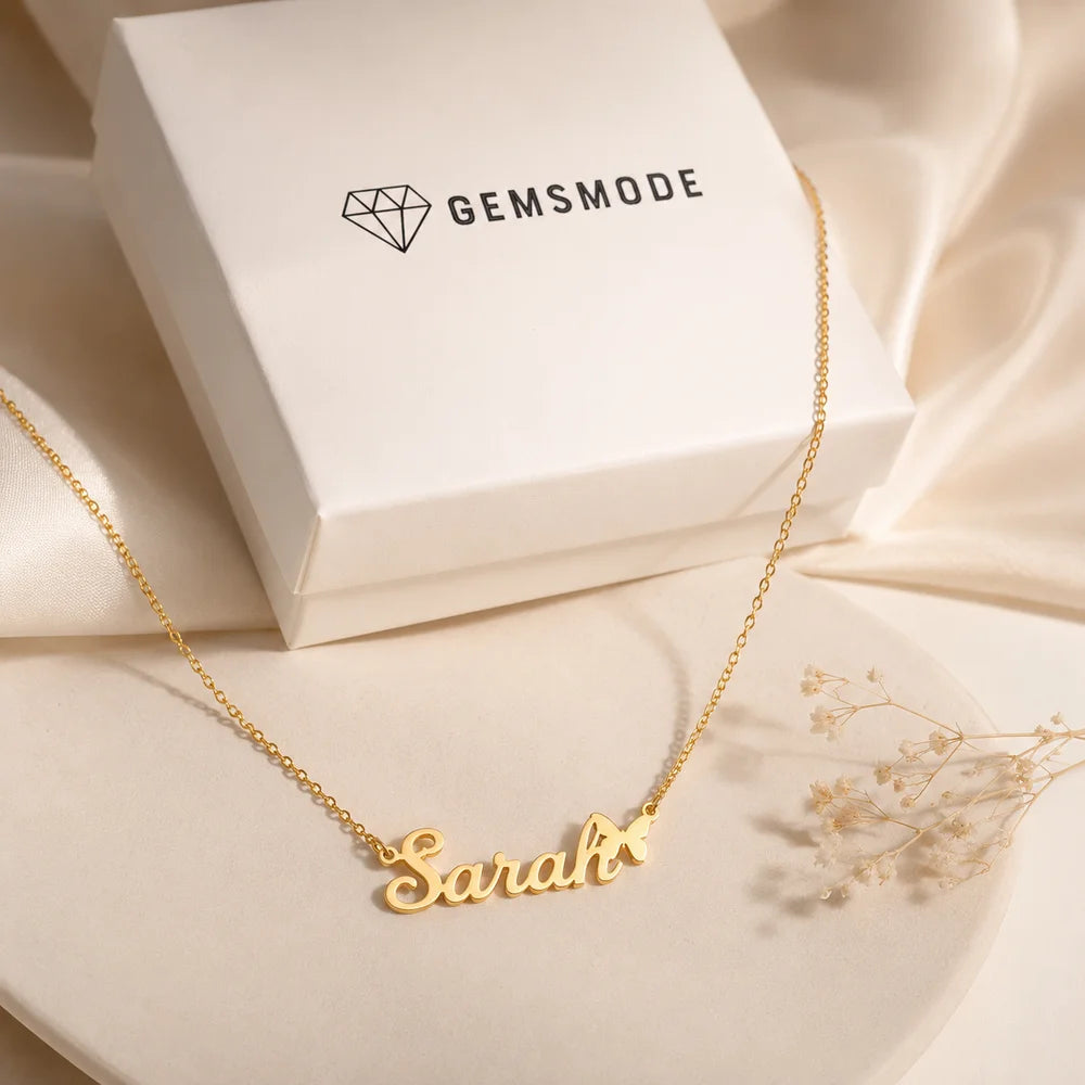 Gold personalized butterfly name necklace displayed with Gemsmode gift box