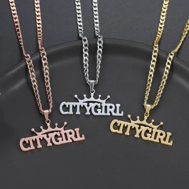 Custom crown name necklace collection in gold, silver, and rose gold.