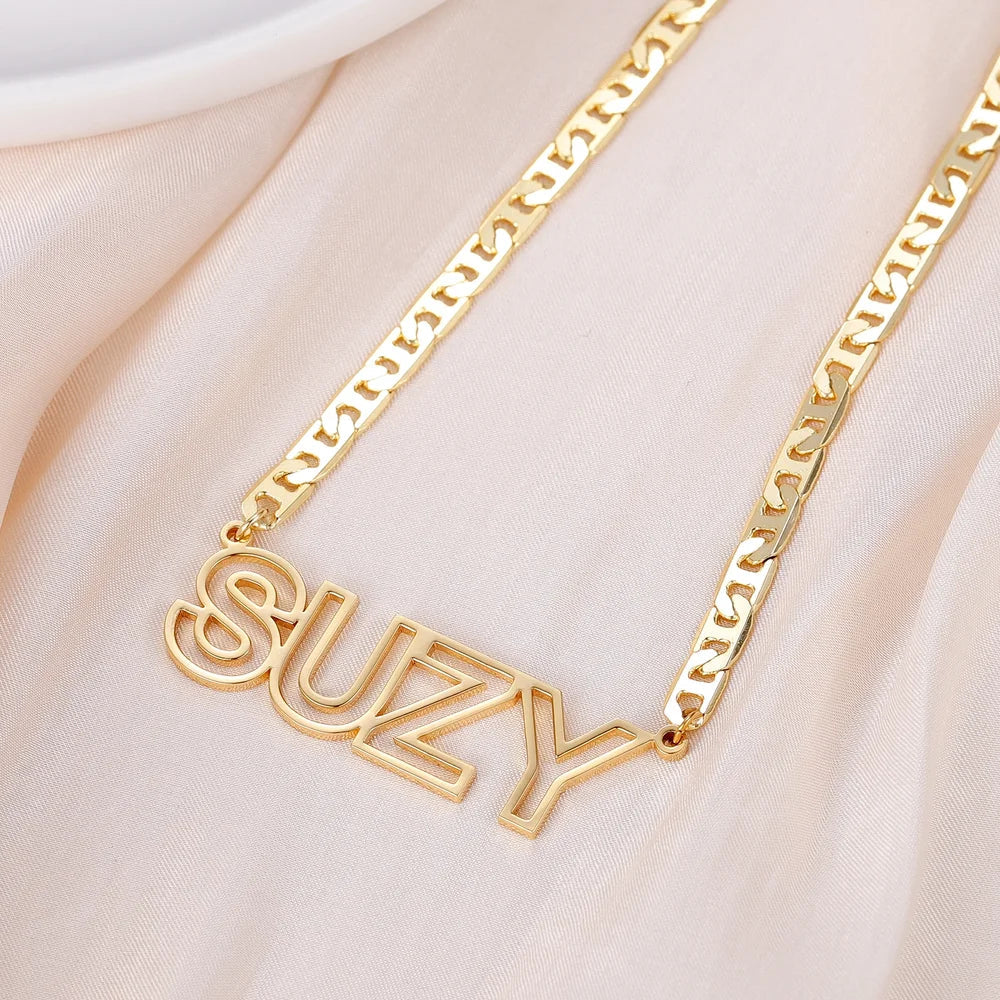 Closeup of Gold Custom Cutout Block Name Necklace for Women