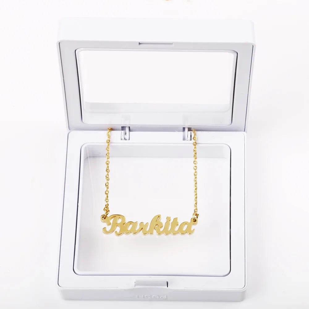 Gold custom name necklace with "Barkita" inscription in a display box.