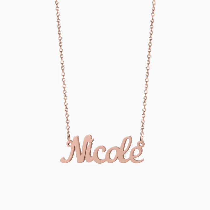 Rose gold custom name necklace with "Nicole" inscription.