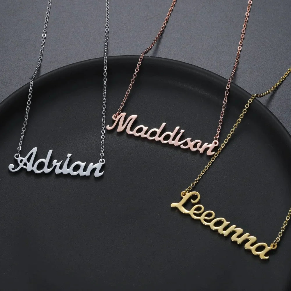 Variety of custom name necklaces in gold, rose gold, and silver with names Adrian, Maddison, and Leeanna.