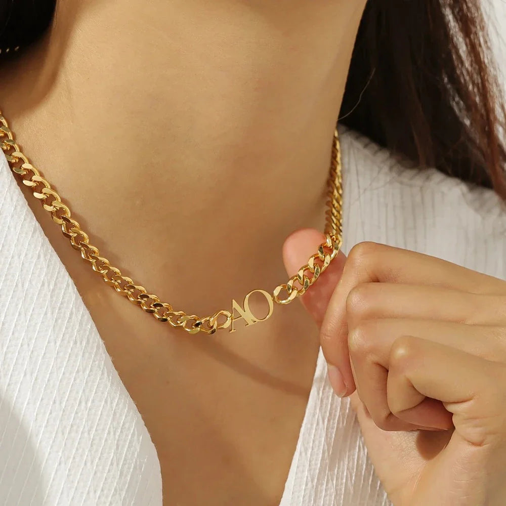 Model wearing Gold Double Initial Necklace with Cuban Chain, close-up