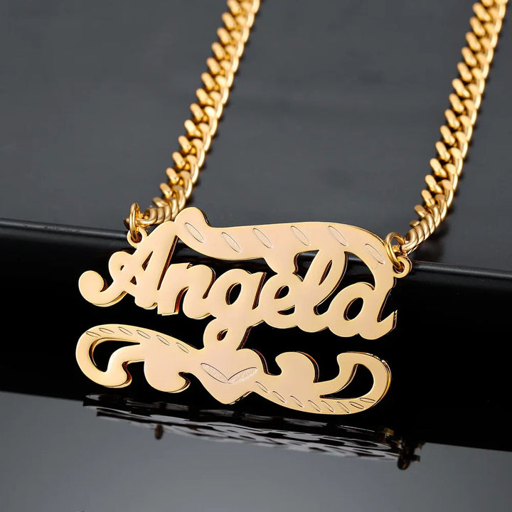 Double Plated 3D Name Necklace in gold with the name 'Angela' on a black background, angled view.