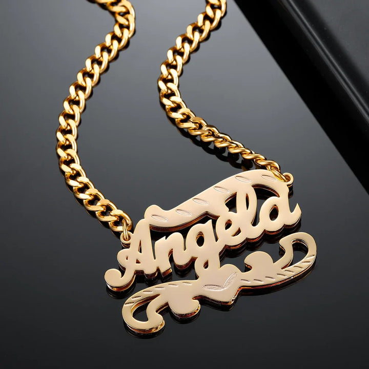 Close-up of Double Plated 3D Name Necklace in gold with the name 'Angela' on a black background.