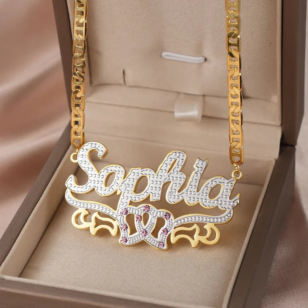 Double plated intertwined hearts name necklace displayed in a box.