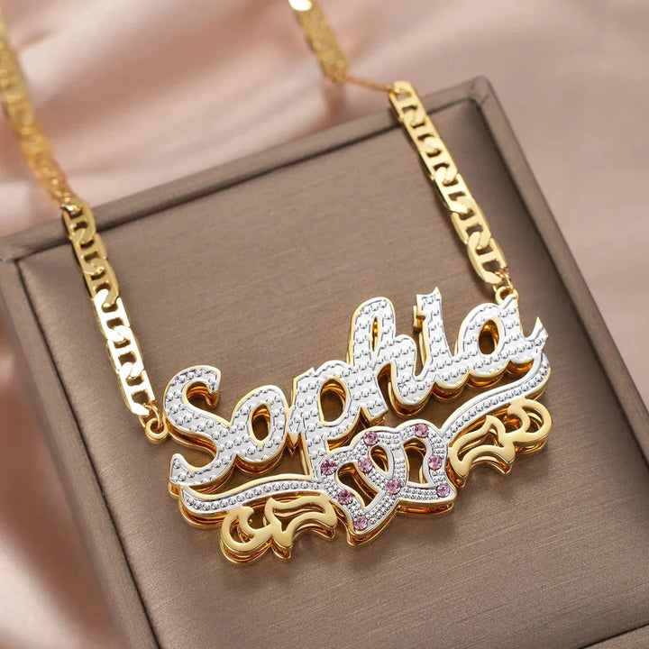 Double plated intertwined hearts name necklace in display box.