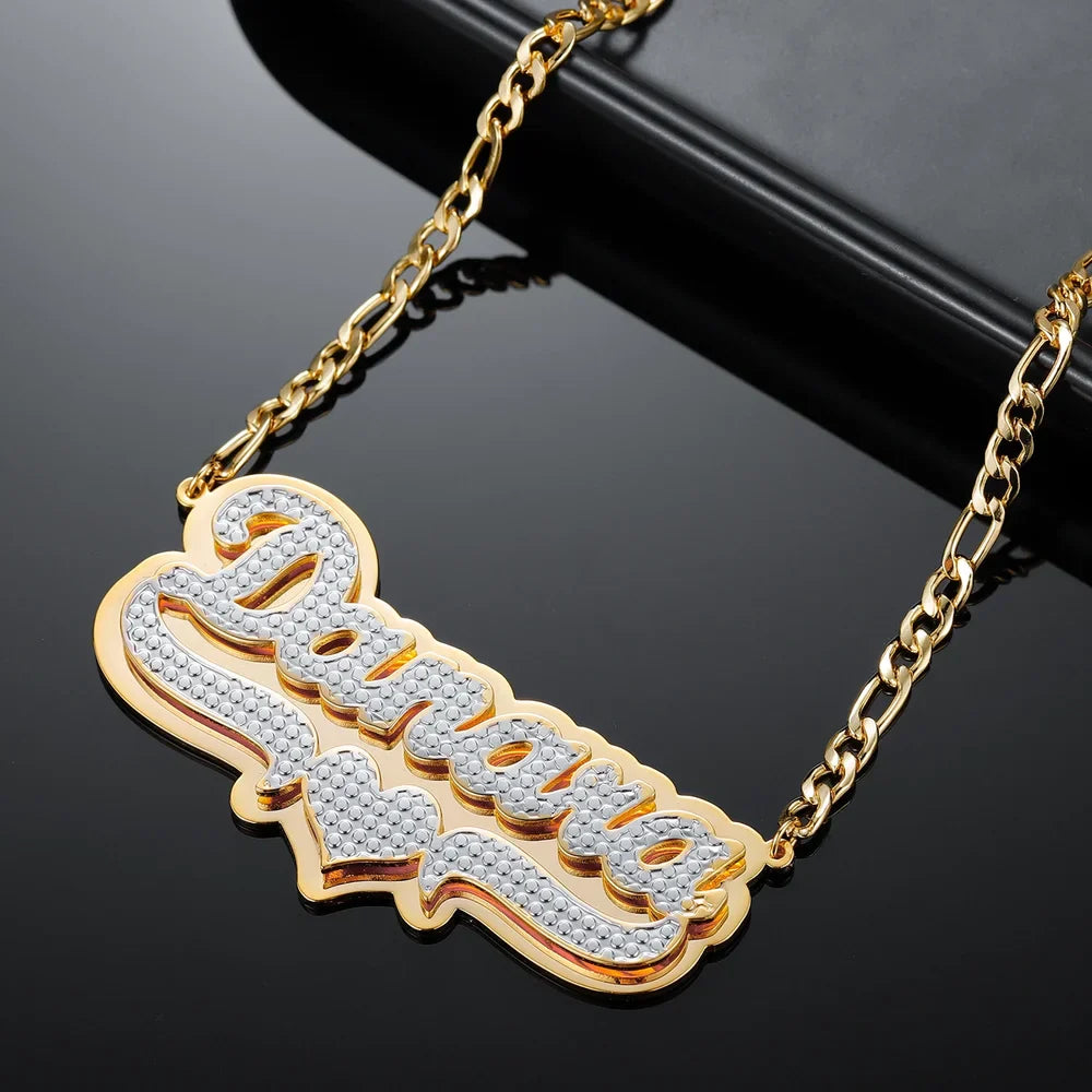 Double plated layered name necklace in gold, displayed