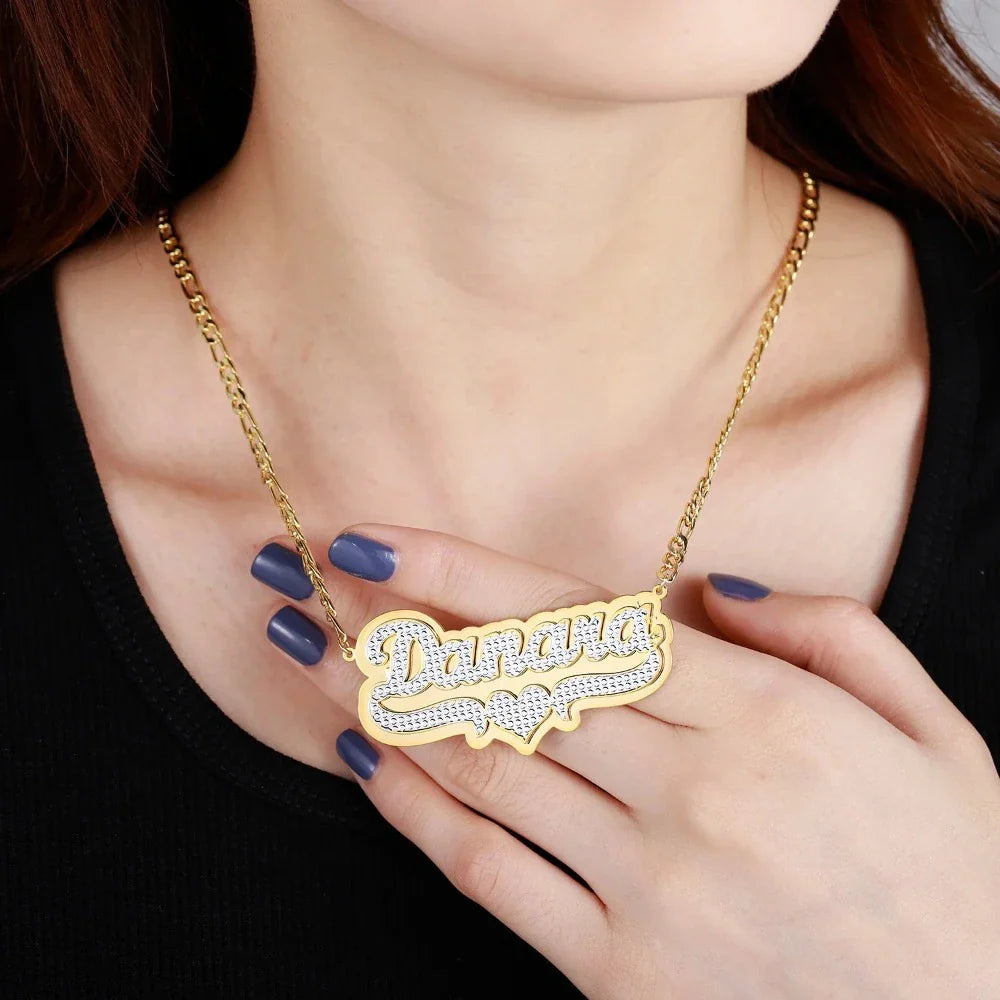 Double plated layered name necklace in gold, worn by model