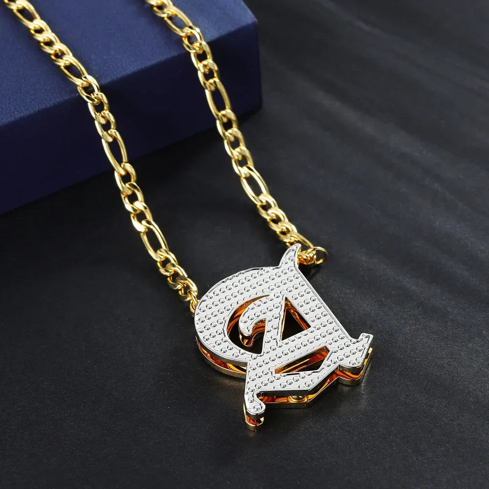 Double Plated Old English Initial Necklace in Gold with Figaro Chain displayed on black background