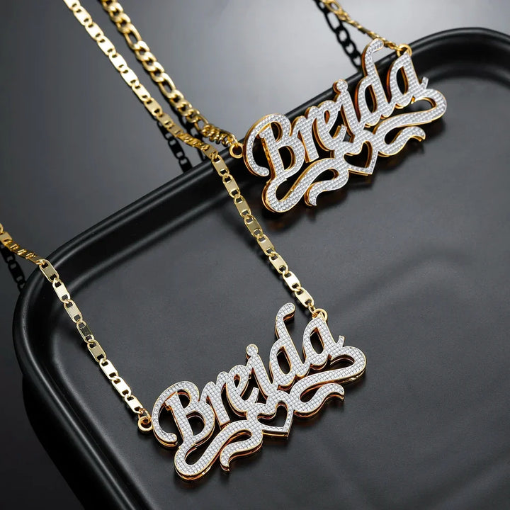 Pair of Double Plated Script Name Necklaces in gold with Figaro chains