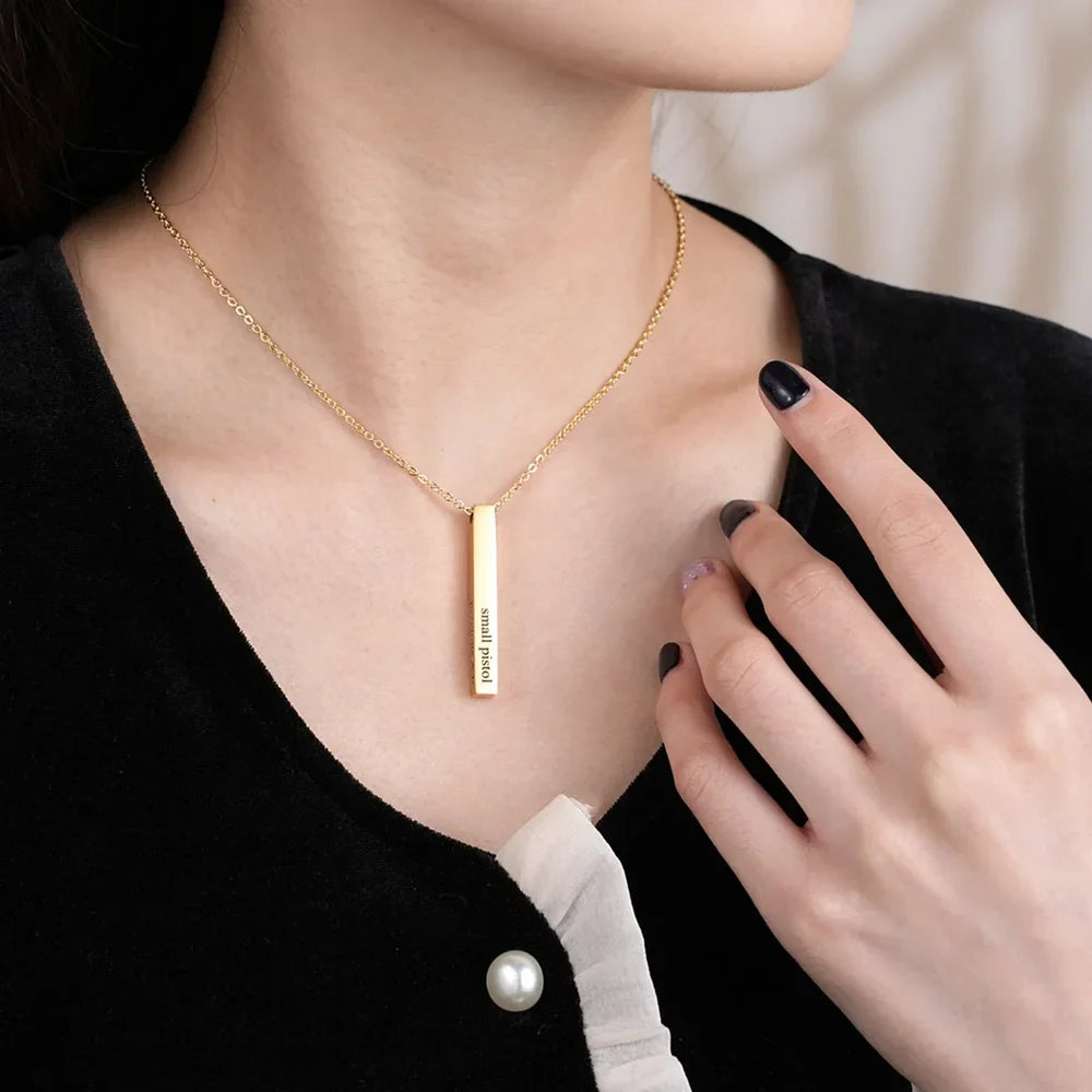 Woman wearing a Gold Engraved Bar Name Necklace