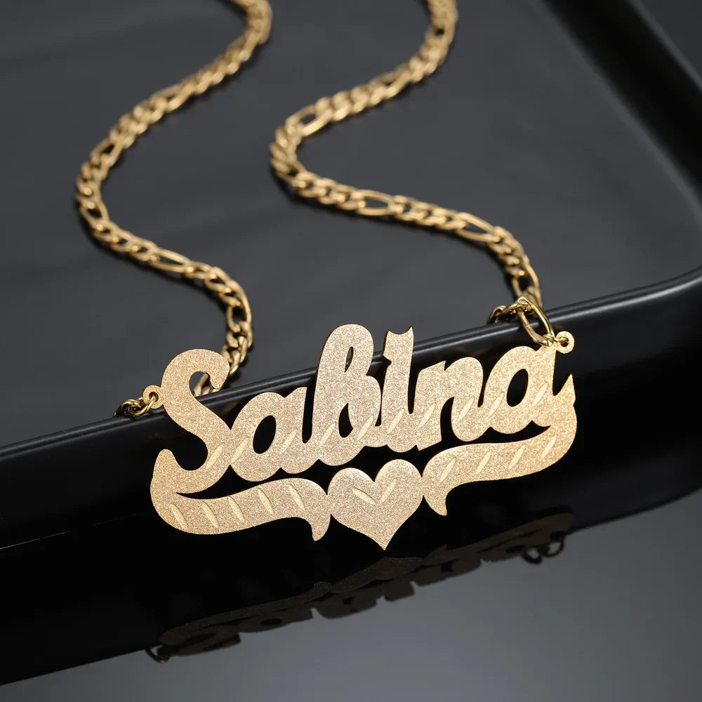 Closeup of Frosted Heart Custom Name Necklace in gold