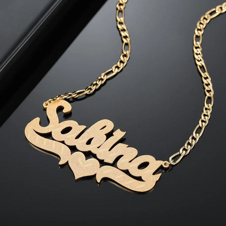 Display of Frosted Heart Custom Name Necklace in gold