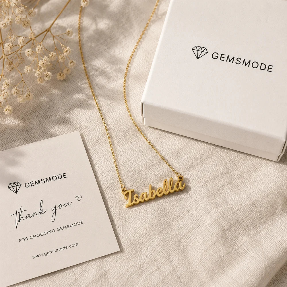 Gold-plated cursive nameplate necklace customized with the name Isabella, displayed with Gemsmode gift box packaging