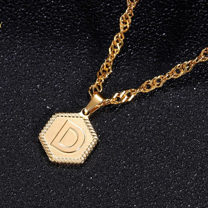 Close-up of Hexagon Initial Necklace in 18k Gold for women