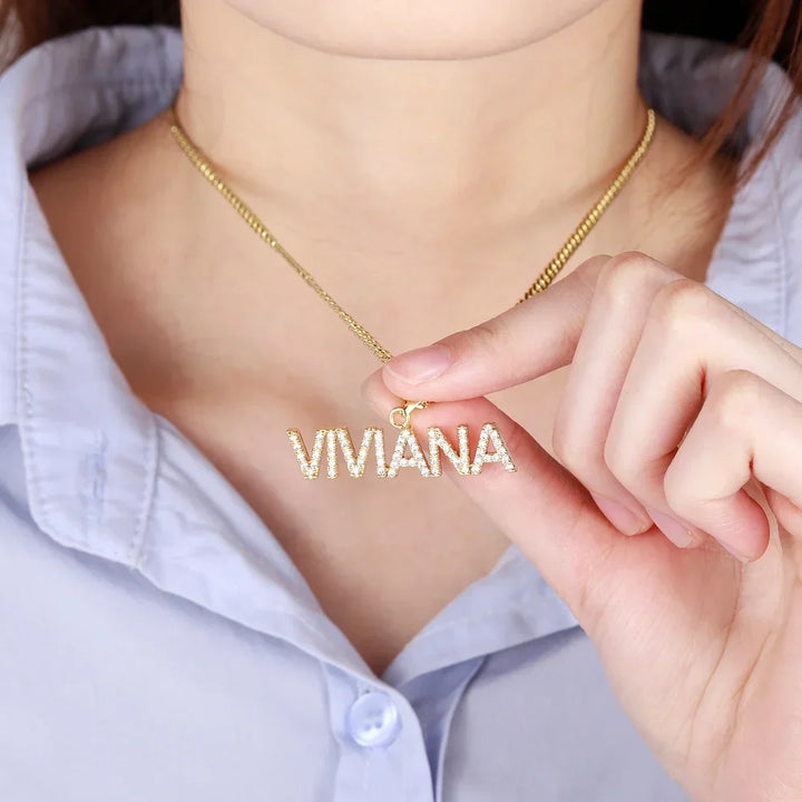 Woman holding Gold Iced Name Necklace with Cuban Chain