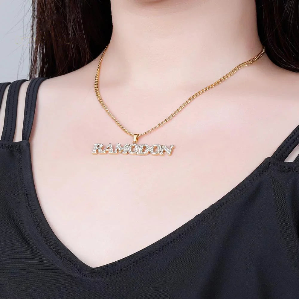 Woman wearing Iced Out Title Name Necklace with gold Cuban chain