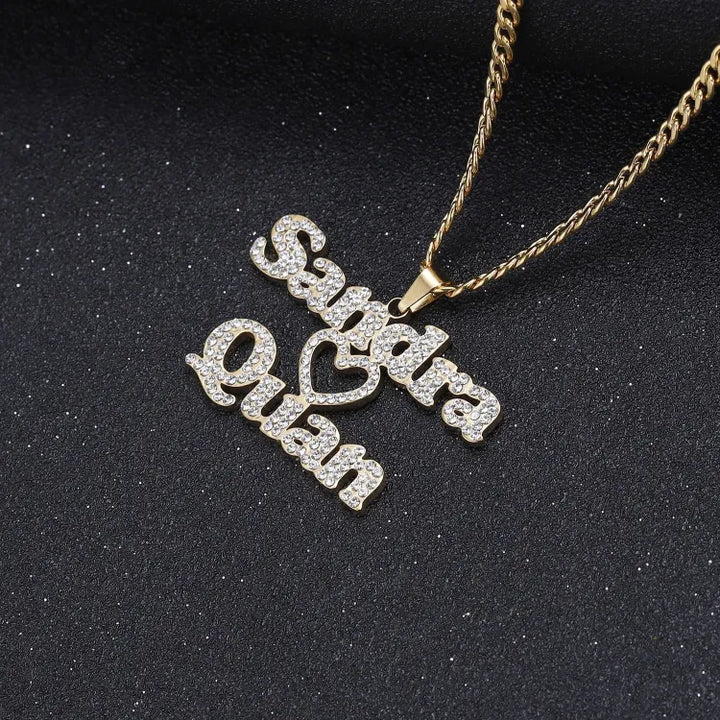 Close-up view of the Iced Out Two Name Heart Necklace in gold