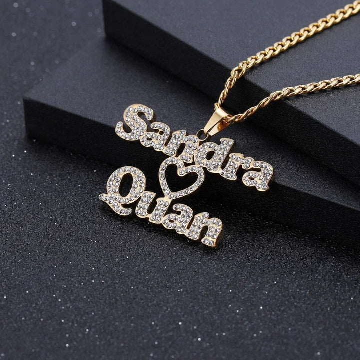 Flat lay view of the Iced Out Two Name Heart Necklace in gold