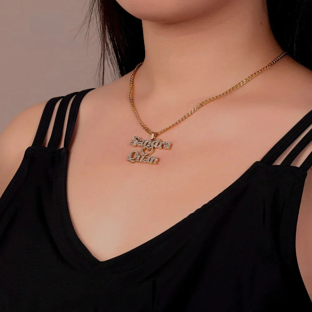  Model wearing the Iced Out Two Name Heart Necklace in gold