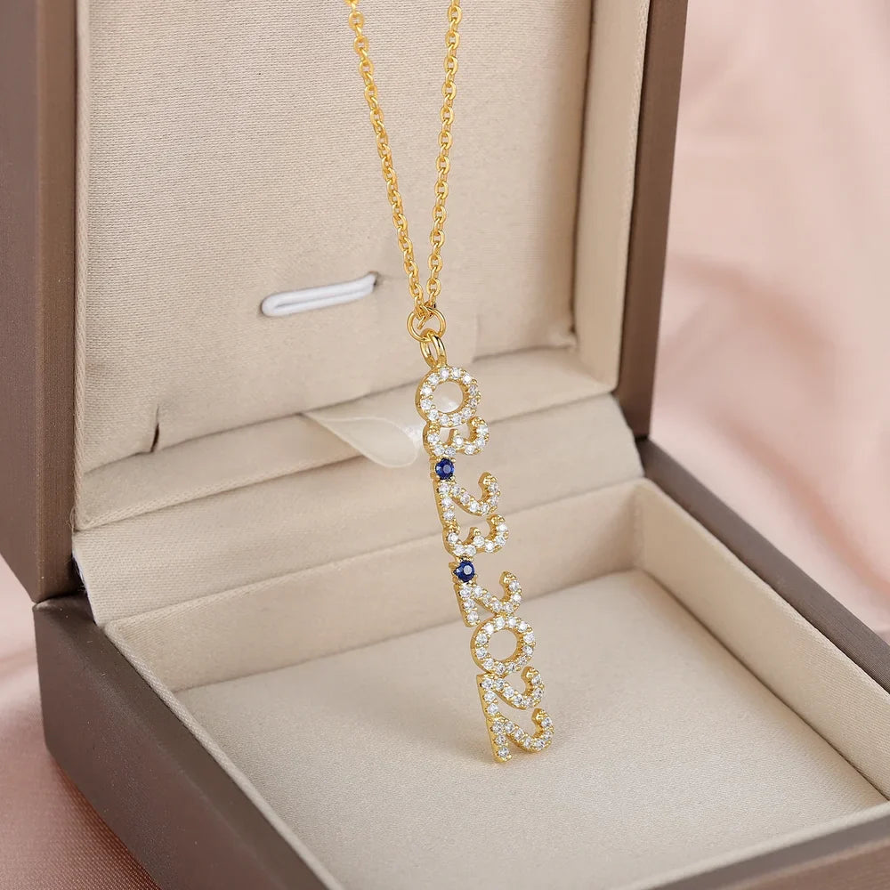 Gold Iced Vertical Date Necklace with link chain displayed in a jewelry box