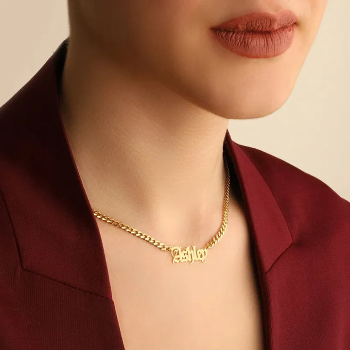 Old English name necklace with Cuban chain in gold, displayed on model