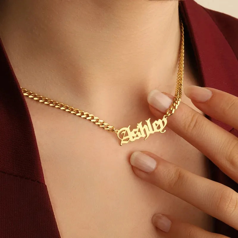 Old English name necklace with Cuban chain in gold, worn by model