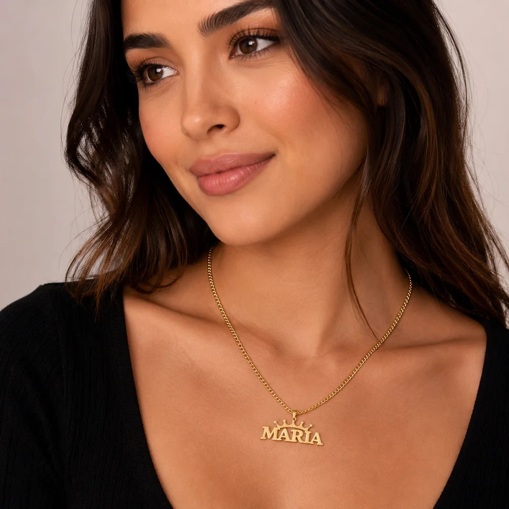 Woman wearing gold personalized crown name necklace with custom name "Maria" on a Cuban chain