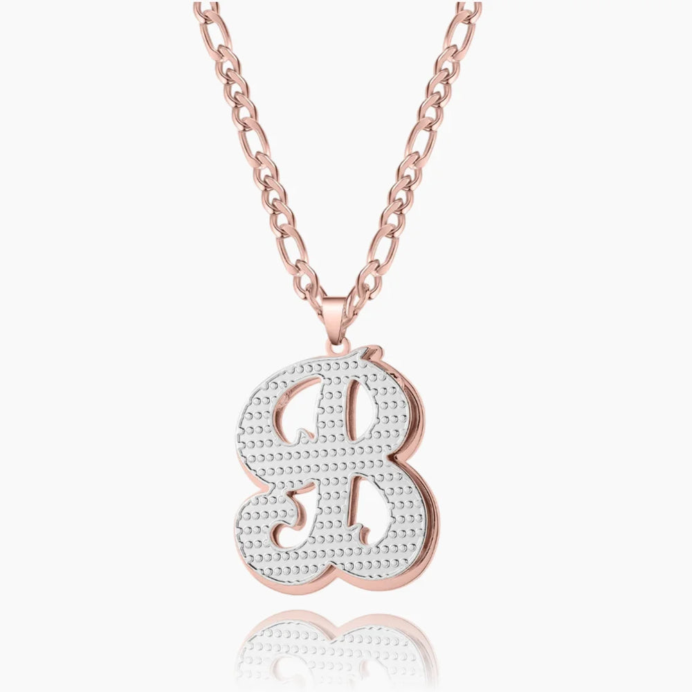 Personalized double plated initial necklace in rose gold with Figaro chain.