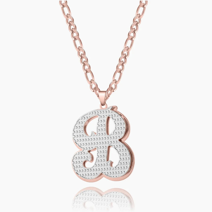 Personalized double plated initial necklace in rose gold with Figaro chain.