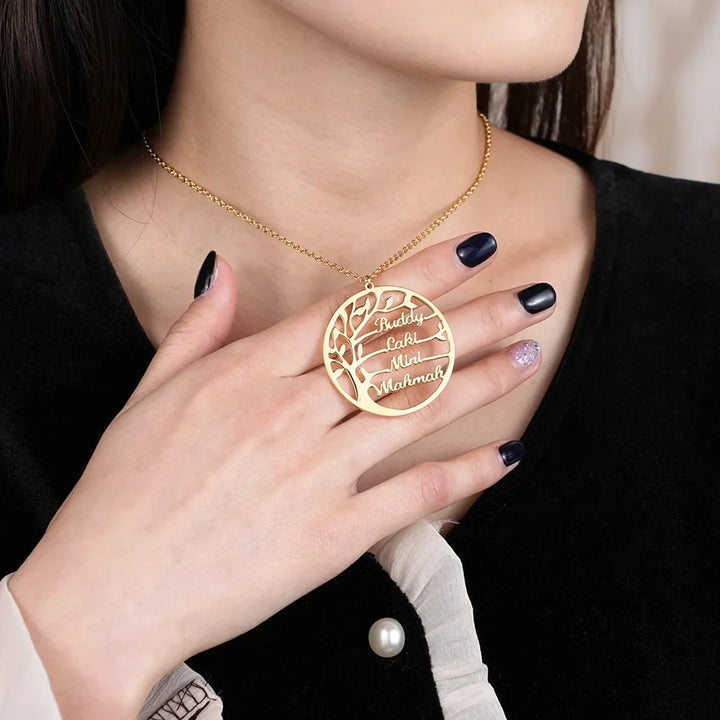 Model Holding Personalized Family Name Necklace in Gold