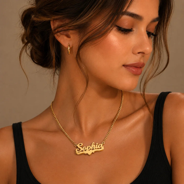 Woman wearing a personalized gold heart name necklace with "Sophia".