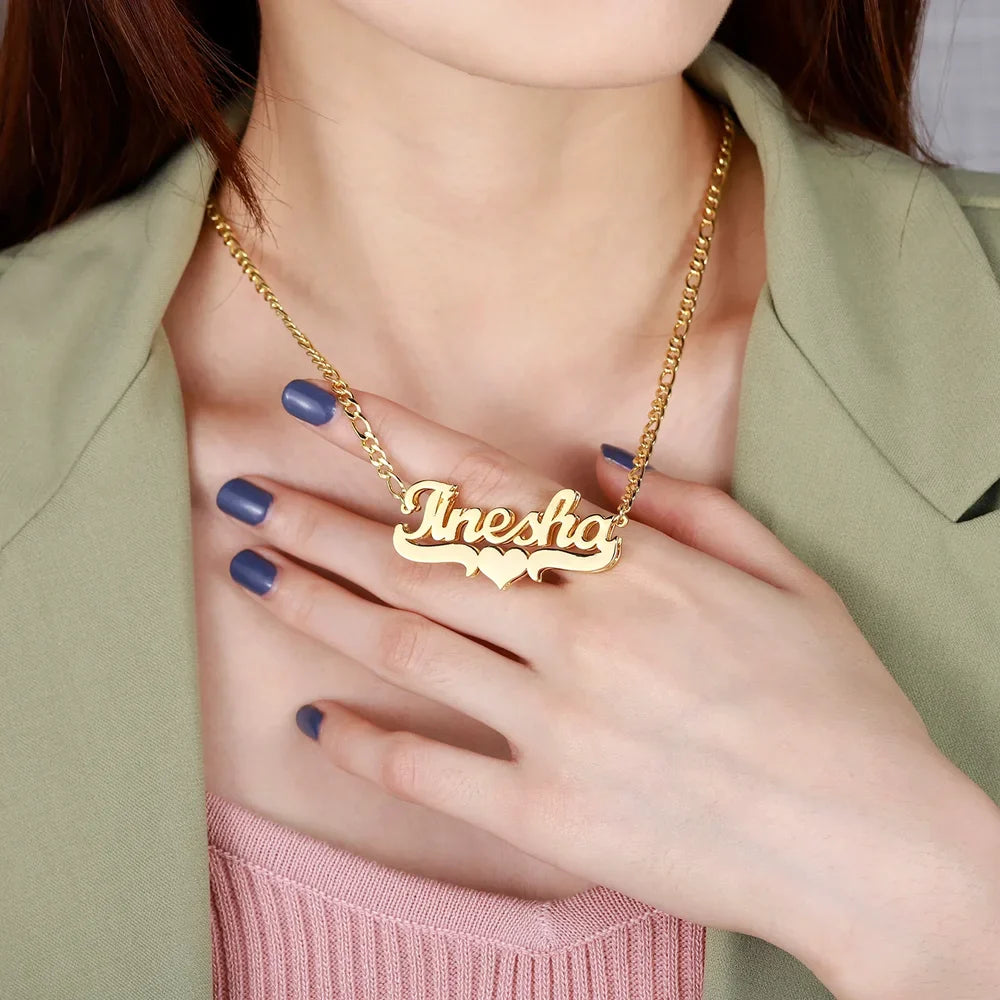 Woman holding Personalized Heart Name Necklace in 18K Gold