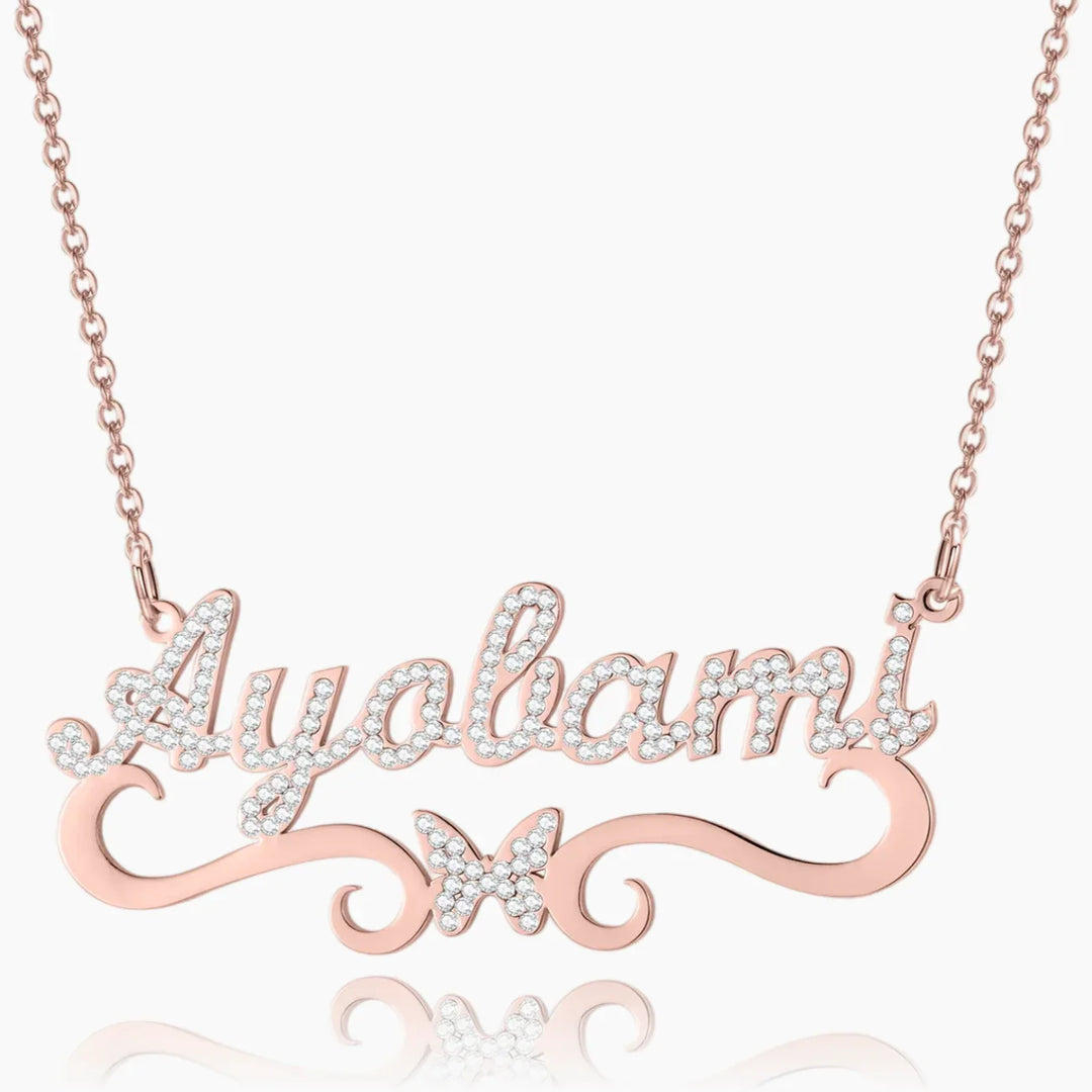 Front view of personalized iced butterfly name necklace in rose gold