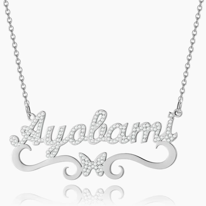 Front view of personalized iced butterfly name necklace in silver 