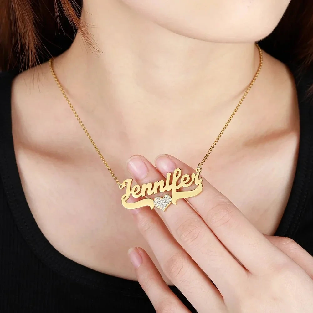 Woman wearing a Personalized Iced Heart Name Necklace in Gold