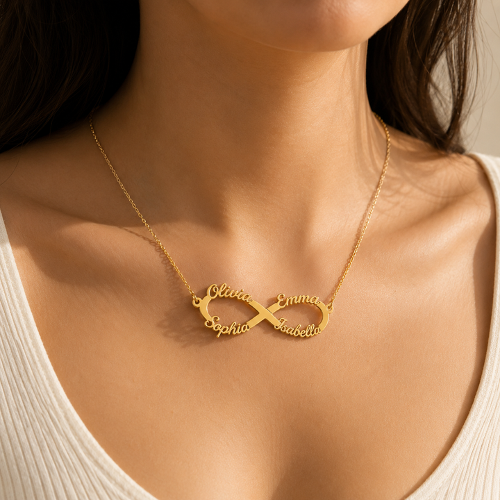 Woman wearing gold personalized infinity name necklace with four custom names
