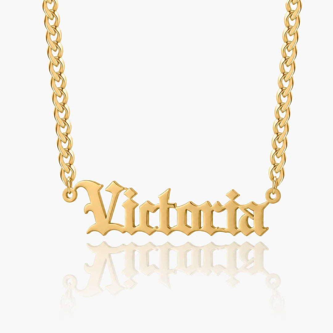 Personalized old english name necklace in gold with custom name "Victoria" on a Cuban chain