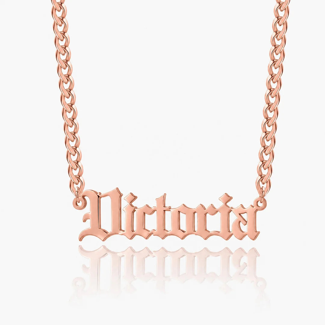 Personalized old english name necklace in rose gold with custom name "Victoria" on a Cuban chain