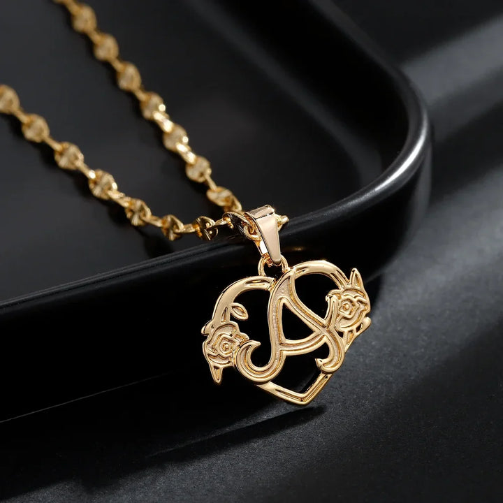 Rose Initial Necklace Displayed on a Black Surface